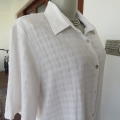 White short sleeve blouse in rayon/polyester fabric in an embossed check pattern size 40/16.As new