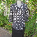 Black and white square patterned top by 'Lisa Spinelli' size 34/10. Elbow length sleeves. As new.