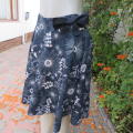 Pretty skater skrt in dark navy with white floral pattern.Yoked style waistband. Size 36/12.As new