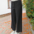 Fashionable wide legged black and white vertical striped pants in size 37/13 by DEFINE.As new.