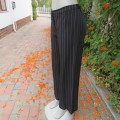 Fashionable wide legged black and white vertical striped pants in size 37/13 by DEFINE.As new.