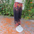 Palazzo pants in black with pretty colourfyl borders in crimson,yellow,mustard and green. Size 34/10