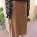 Smart A-Line calf length suede look camel skirt with seam at back and front. Zip at back.Size 42/18