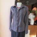 Power print top in red,black and white by FASHION EXPRESS in size 36/12. Button down.New cond.