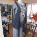 Grey cotton stretch long sleeve slip over top with logo and front black waterfall attachment.32