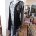 Grey cotton stretch long sleeve slip over top with logo and front black waterfall attachment.32