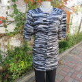 As new long top in black,white and grey animal print. Button down front.Size34/10 by SHELLEY