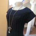 Up style black cable knit long top/short dress in size 34/10 by SEDUCTION. Capped sleeves.