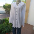 Oversized white cotton long top with button down front and decorated bib.Size 50/26. New condition