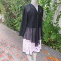 Waterfall style sheer black long sleeve top with V front size 38/14. In 100% polyester fabric.