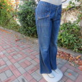 Boyfriend style vertical striped blue denim jeans. Boot legged. Size 40/16 by 'Estee Egee'.