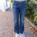 Boyfriend style vertical striped blue denim jeans. Boot legged. Size 40/16 by 'Estee Egee'.