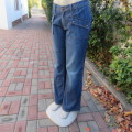 Boyfriend style vertical striped blue denim jeans. Boot legged. Size 40/16 by 'Estee Egee'.