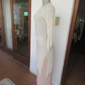 Pretty long permanent creased high-low cream top with long angel point sleeves size 32/8. As new.