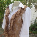Stylish light brown acrylic stretch lace sleeveless gilet with wide frill all around. Size 34/10.