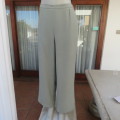 Comfy ankle length fern green pants in size 40/16 by `WOOLWORTHS`. In 100% wash + wear polyester.