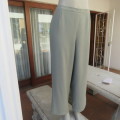 Comfy ankle length fern green pants in size 40/16 by `WOOLWORTHS`. In 100% wash + wear polyester.