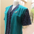Textured teal colour open hanging sleeveless top in size 38/14. With pleats on front. As new.