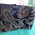 Amazing black with gold,beige and light brown paisley pattern with shine. From size 36/40. As new.
