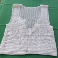 Hand crochet little white waistcoat for girl of 7 to 8 years old chest 65 cm. Never used.