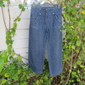 Straight legged blue denim pants for girl 12 years old. High waist with zip and 3 buttons on front.