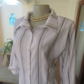 White extra long top with brown,mustard and white embossed vertical stripes. Size 42/18 by PRIMA.
