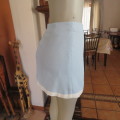 Stunning fully lined baby blue mini skirt with white seam in size 30/6. Pencil style. New condition