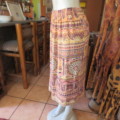 Baroque printed creased viscose skirt. Size 36/12. Low calf length. Elasticated waist.Good condition