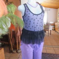 Cute little black netting top. Pale lilac underlay on front. Scooped neckline. Size 34/10. as new.