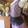 Cute little black netting top. Pale lilac underlay on front. Scooped neckline. Size 34/10. as new.