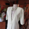 Light mint green short sleeve jacket/cover-up low V-front. Size 34/10 by SOFT BLOUSE. New condition.