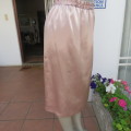 Glamour calf length nude colour skirt. Fully lined elasticated waist. Size 36/12. New condition.