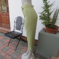 Boutique made light avo green capri pants. High waist with short slits on legs. Size 34/10. As new.