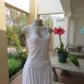 Embellished slip it over strappy top. For evening or day wear. Size 32 to 34. New condition.