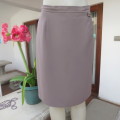 Smart medium brown knee length pencil skirt. Zip at back. Size 38/14 by DIJON. New condition.