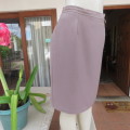 Smart medium brown knee length pencil skirt. Zip at back. Size 38/14 by DIJON. New condition.