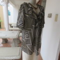 Beautiful slip-over geometric printed loose top V-neckline Size 48-24 By `Donatella` New condition