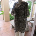 Beautiful slip-over geometric printed loose top V-neckline Size 48-24 By `Donatella` New condition
