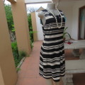 Beautiful black and cream sleeveless dress Size 34 as on doll Can fit size 36 Good condition