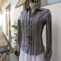 Black and white vertical striped long sleeve shirt V-neckline.and collar  Size 32/8 By Insync`As new