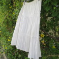 White vertical creased tiered skirt for girls of 11 to 12 years old.Elasticated waist New condition.