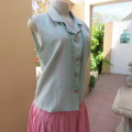 Boutique made sleeveless top in soft blue/pink check pattern. Size 38/14. As new. Button down front