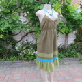 Halter neck olive green dress with lovely border and frill. Size 34/10.By `Woolworths`.As new.