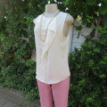 Unique cream sleeveless top with button down back. Size 34/10. By `Oakridge`. New condition.