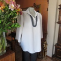 Comfy but smart white slip-over maternity top by `du date` in size 42/18. As new. Slitted sides.