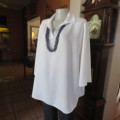 Comfy but smart white slip-over maternity top by `du date` in size 42/18. As new. Slitted sides.