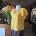 Very sweet little cropped mustard top with colourful floral posies. Size 36/12. By `Edition`. As new
