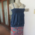 Cute denim strappy top with wide elasticated area top and bottom. Size 34/10. Very good condition.