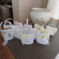 We have ten white and three cream decorated bags suitable for wedding cake or confetti. About 9x7cm.