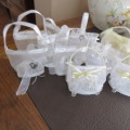 We have ten white and three cream decorated bags suitable for wedding cake or confetti. About 9x7cm.